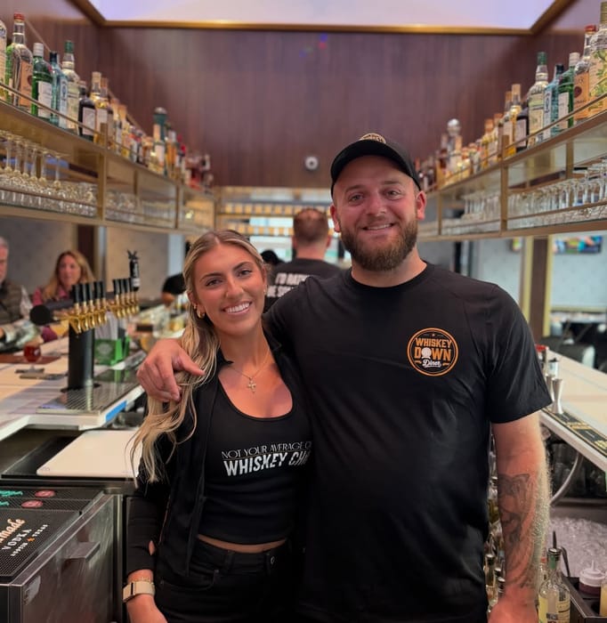 Two of the Babylon Village bar team behind the taps