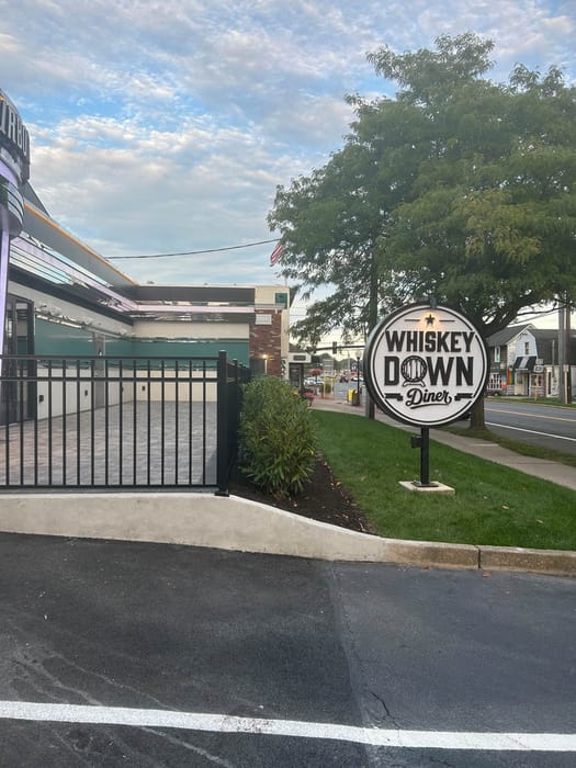 The Whiskey Down Diner sign on Main Street in Babylon Village