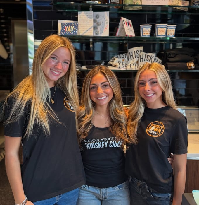 Three of the Babylon Village team behind the counter