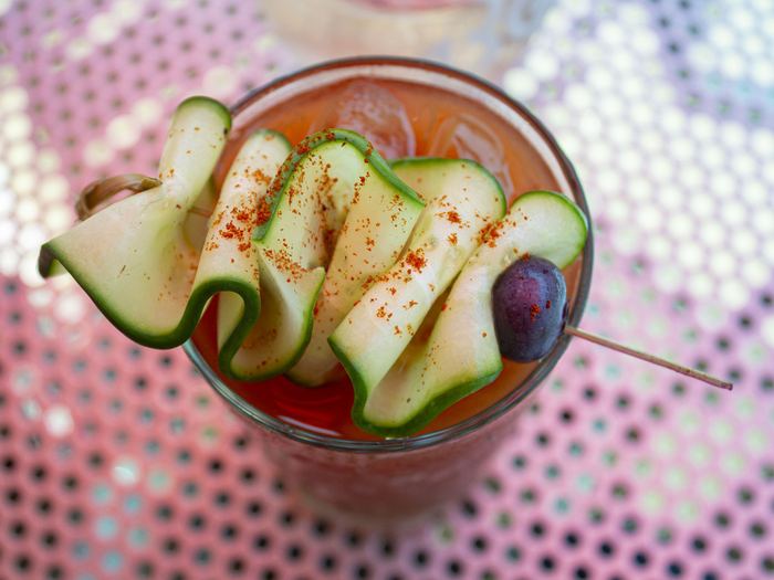 A bloody mary with cucumber ribbon and chili