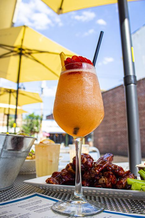 Frozen Aperol spritz under a yellow umbrella